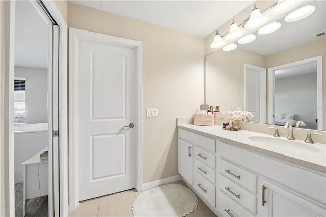 a bathroom with a double vanity sink mirror and