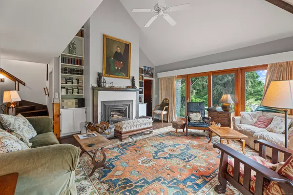 a dining room with furniture and window