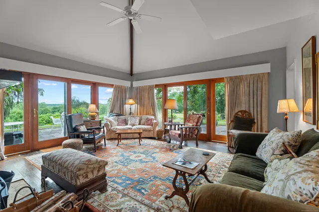 a dining room with furniture and window