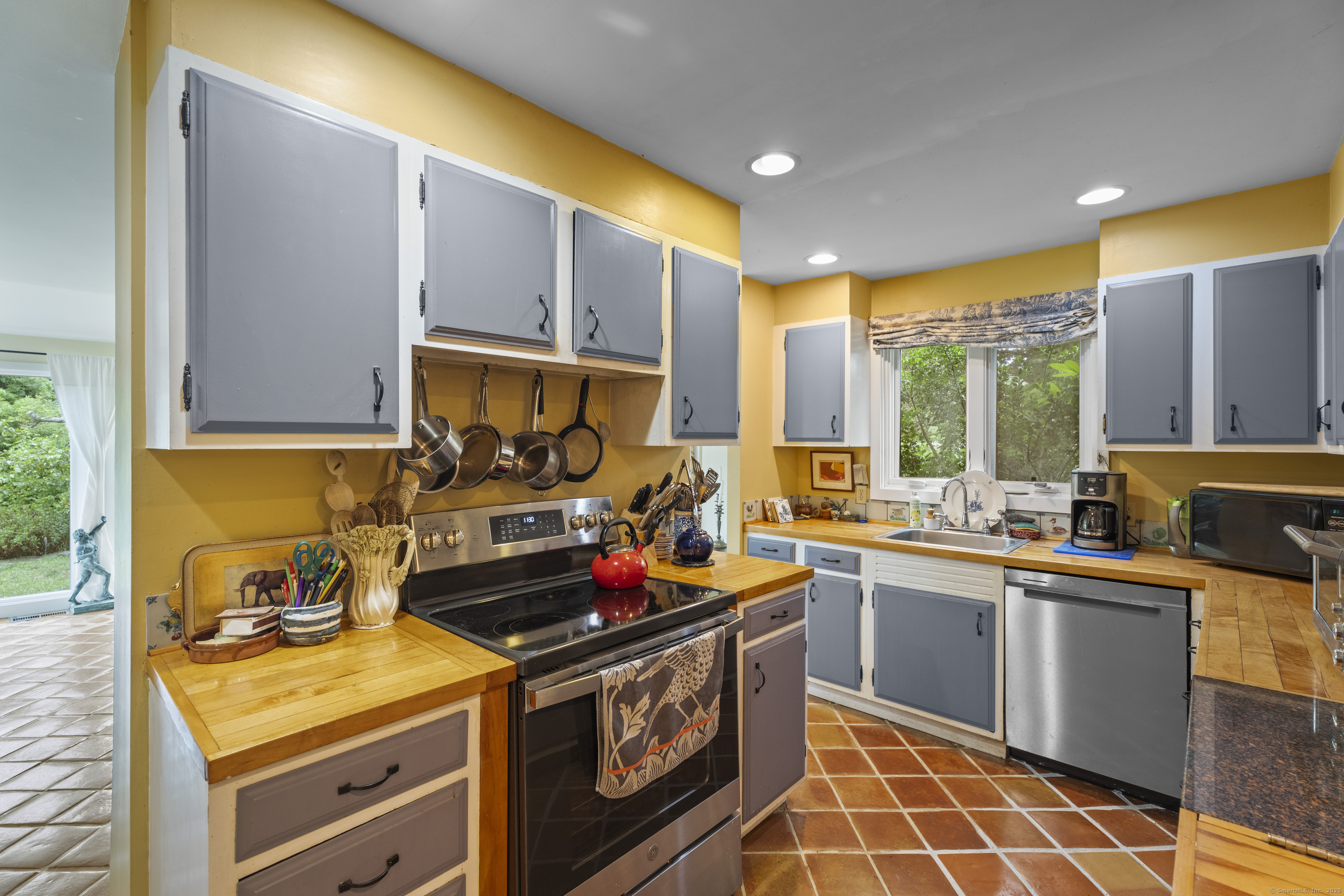 55 A Anna Farm Road West North Stonington, CT 06359 - Photo 16 of 41 a kitchen with a sink a stove and cabinets