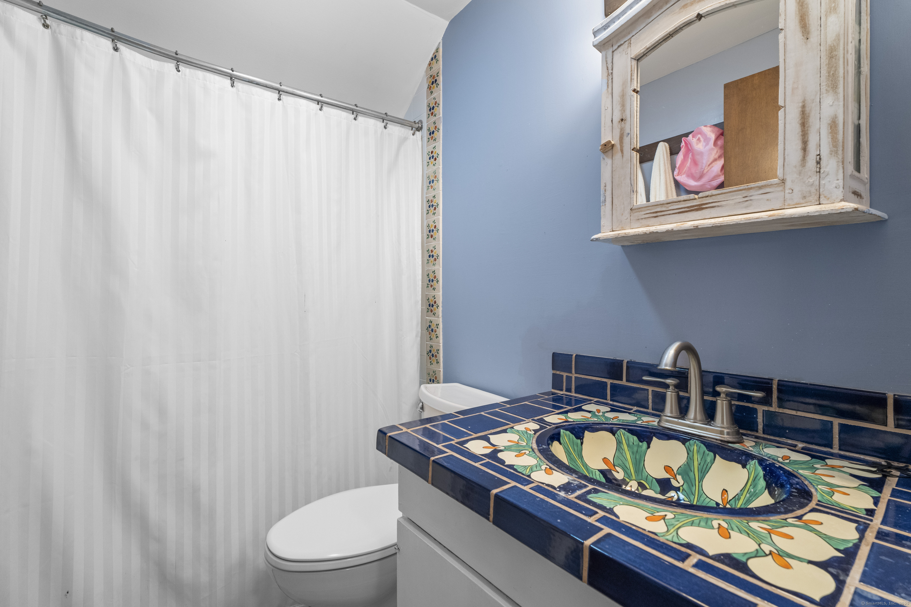 55 A Anna Farm Road West North Stonington, CT 06359 - Photo 25 of 41 a bathroom with a toilet and sink
