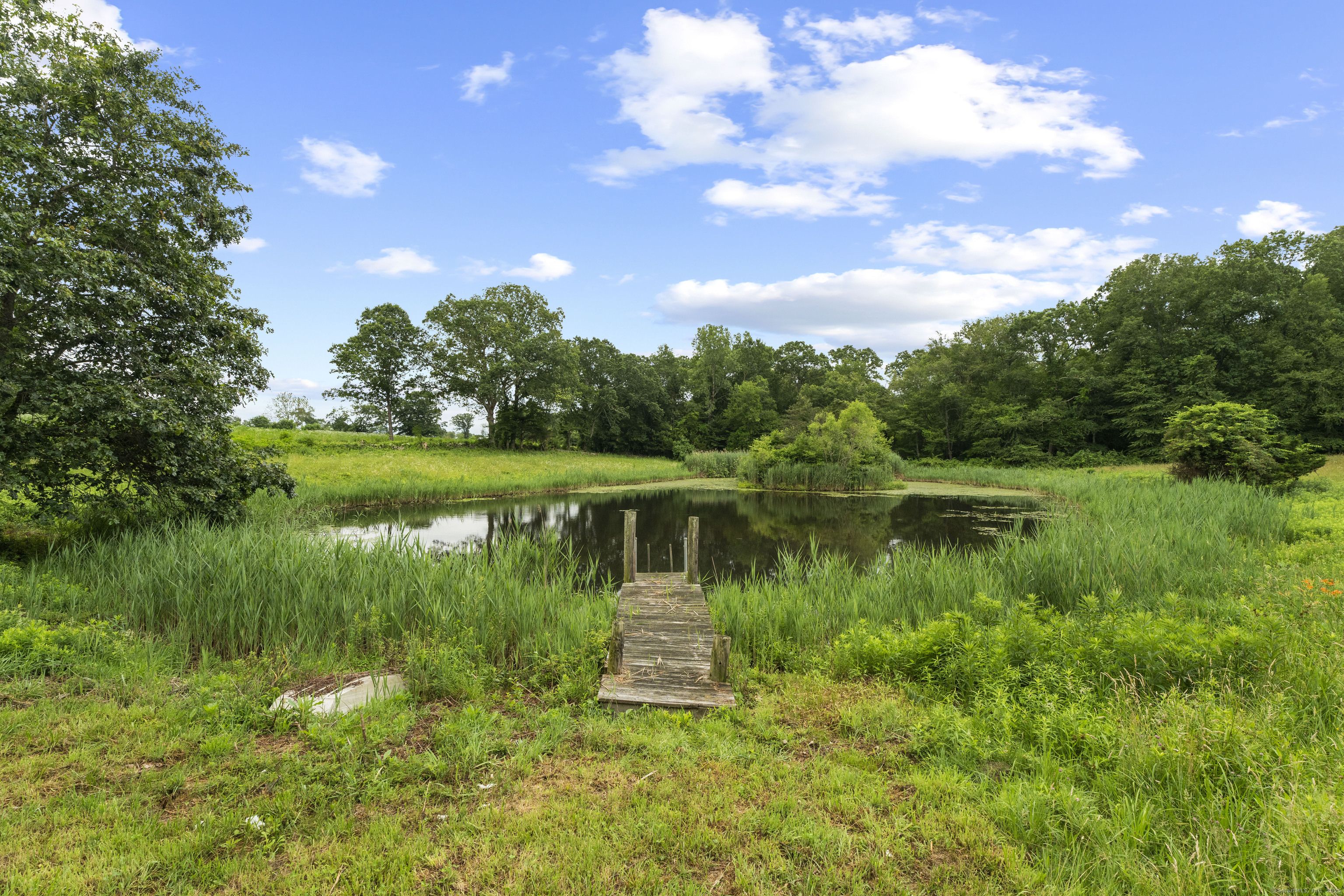 55 A Anna Farm Road West North Stonington, CT 06359 - Photo 35 of 41 a view of a lake with a yard
