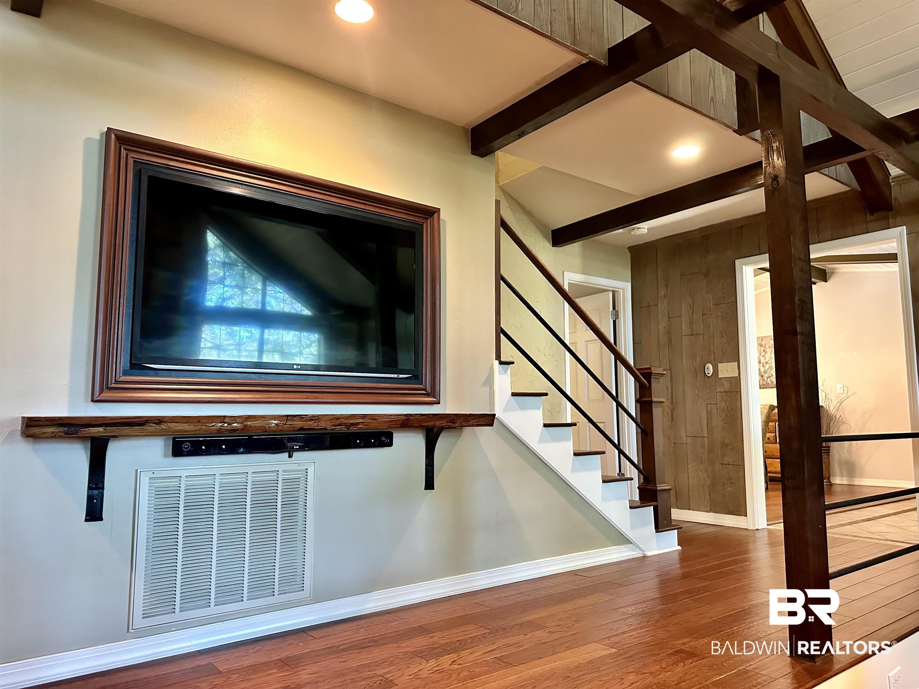 117 Belle Meade Brewton, AL 36426 - Photo 6 of 62 Stairway featuring hardwood / wood-style flooring and vaulted ceiling with beams