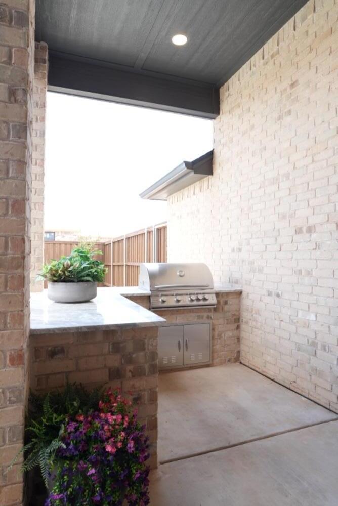 4101 149th Street Lubbock, TX 79423 - Photo 48 of 53 a view of kitchen with a sink and dishwasher with yard