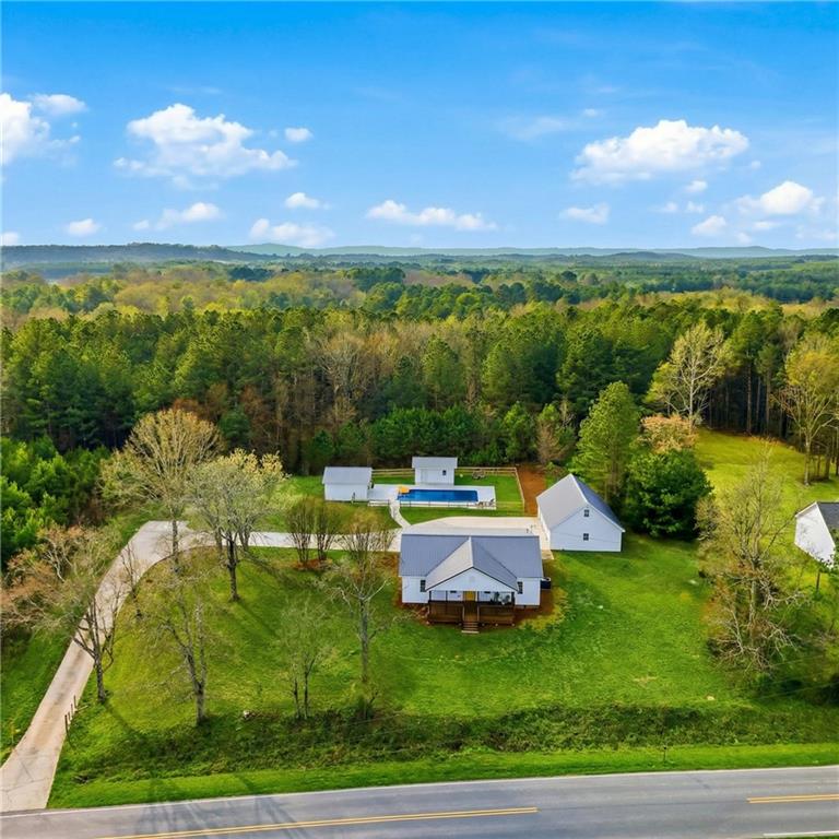 a view of a garden with lawn chairs