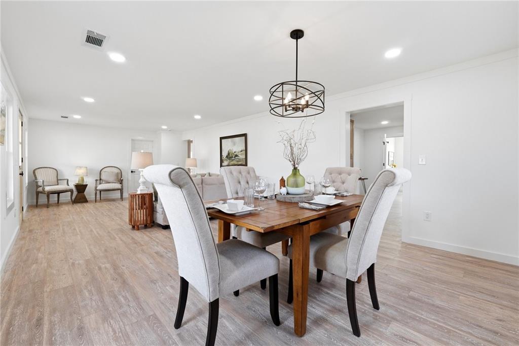 4015 Maple Grove Church Road Resaca, GA 30735 - Photo 12 of 42 a view of a dining room with furniture wooden floor and chandelier