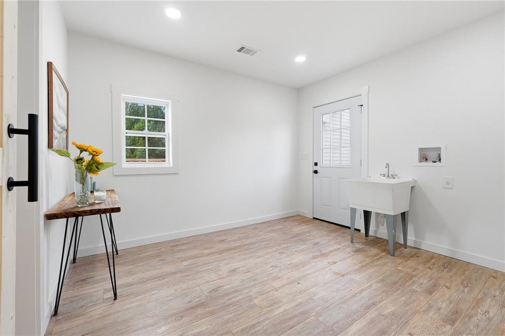 4015 Maple Grove Church Road Resaca, GA 30735 - Photo 13 of 42 a view of an empty room with a window and wooden floor
