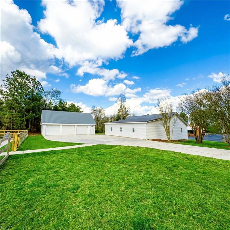 4015 Maple Grove Church Road Resaca, GA 30735 - Photo 27 of 42 a view of a house with a yard