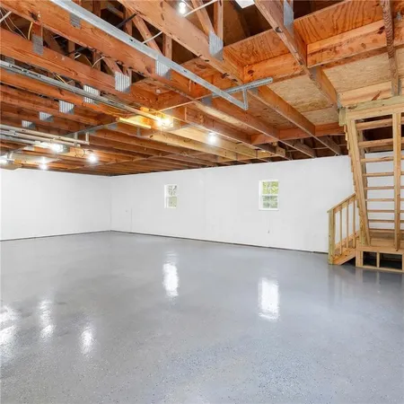 a view of a room with wooden floor