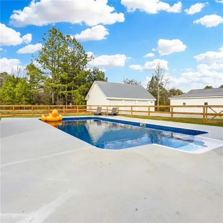 a view of swimming pool with outdoor seating