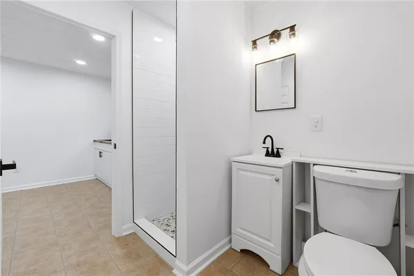 a bathroom with a toilet sink and tub