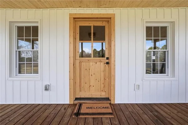a view of a door house with wooden floor