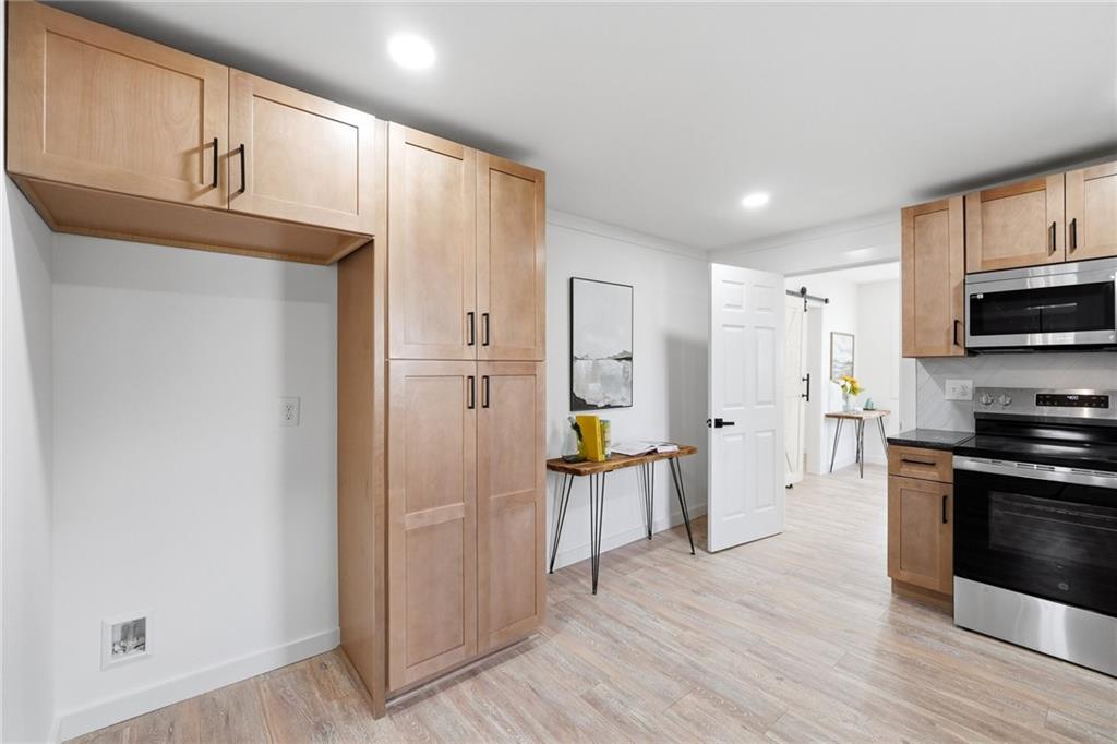 4015 Maple Grove Church Road Resaca, GA 30735 - Photo 8 of 42 a kitchen with stainless steel appliances a refrigerator and a stove top oven