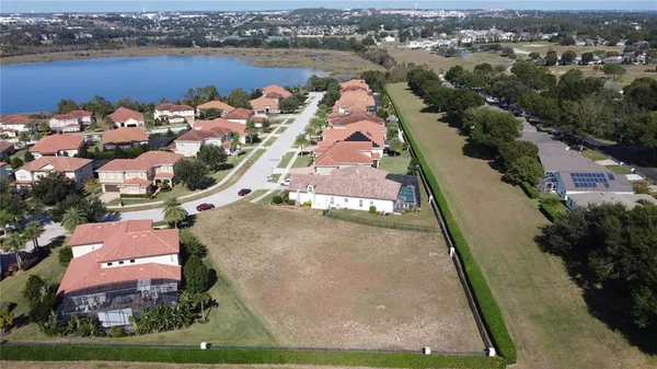an aerial view of a house with a lake view