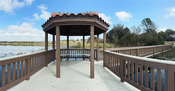 a view of balcony with furniture and city view
