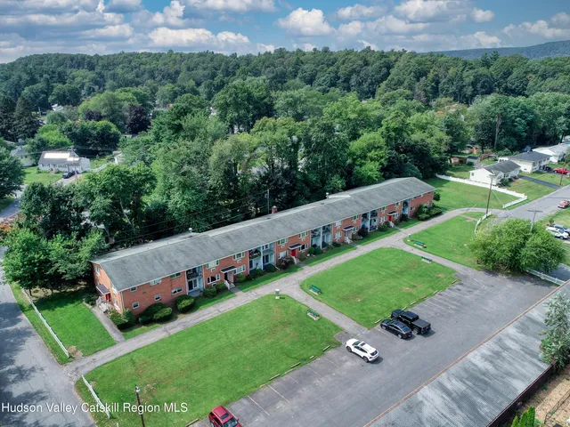 an aerial view of a house and a yard