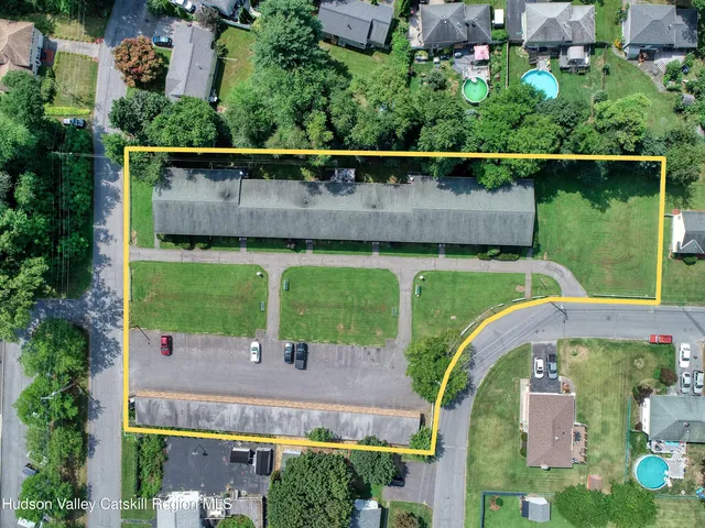 an aerial view of a house with a garden