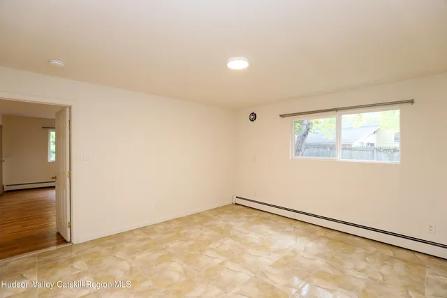 an empty room with a empty space and window