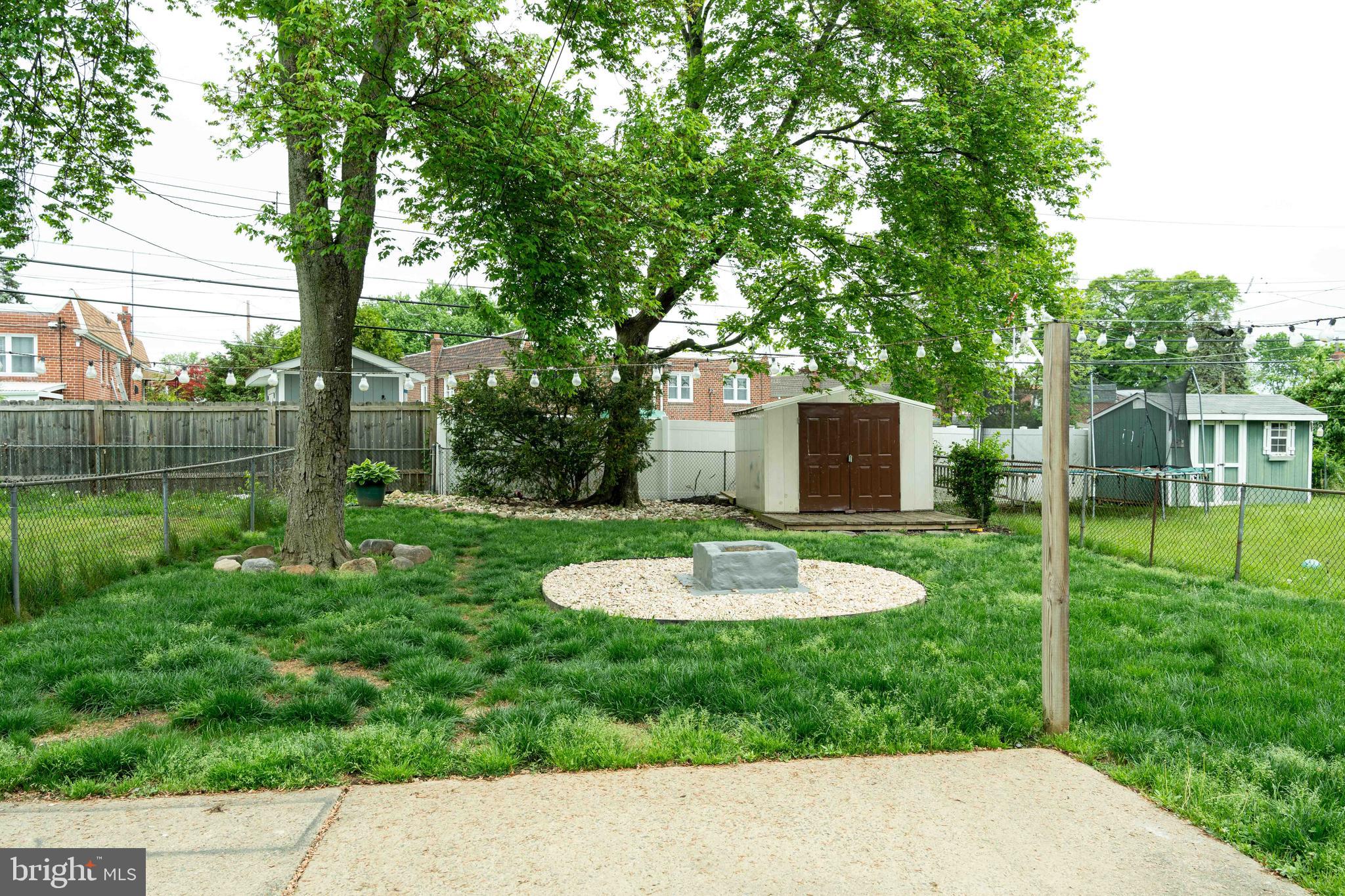 1151 Morefield Road Philadelphia, PA 19115 - Photo 20 of 22 a backyard of a house with a garden and outdoor seating