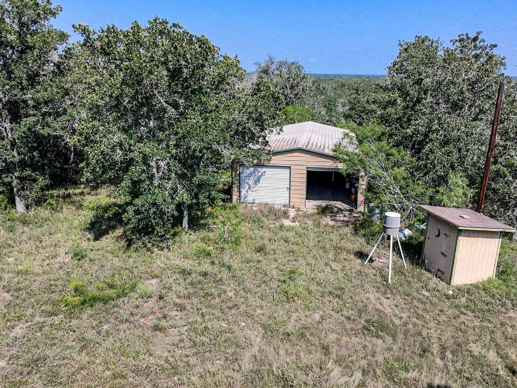 502 Robertson Road Smiley, TX 78159 - Photo 12 of 31 a front view of a house with a garden