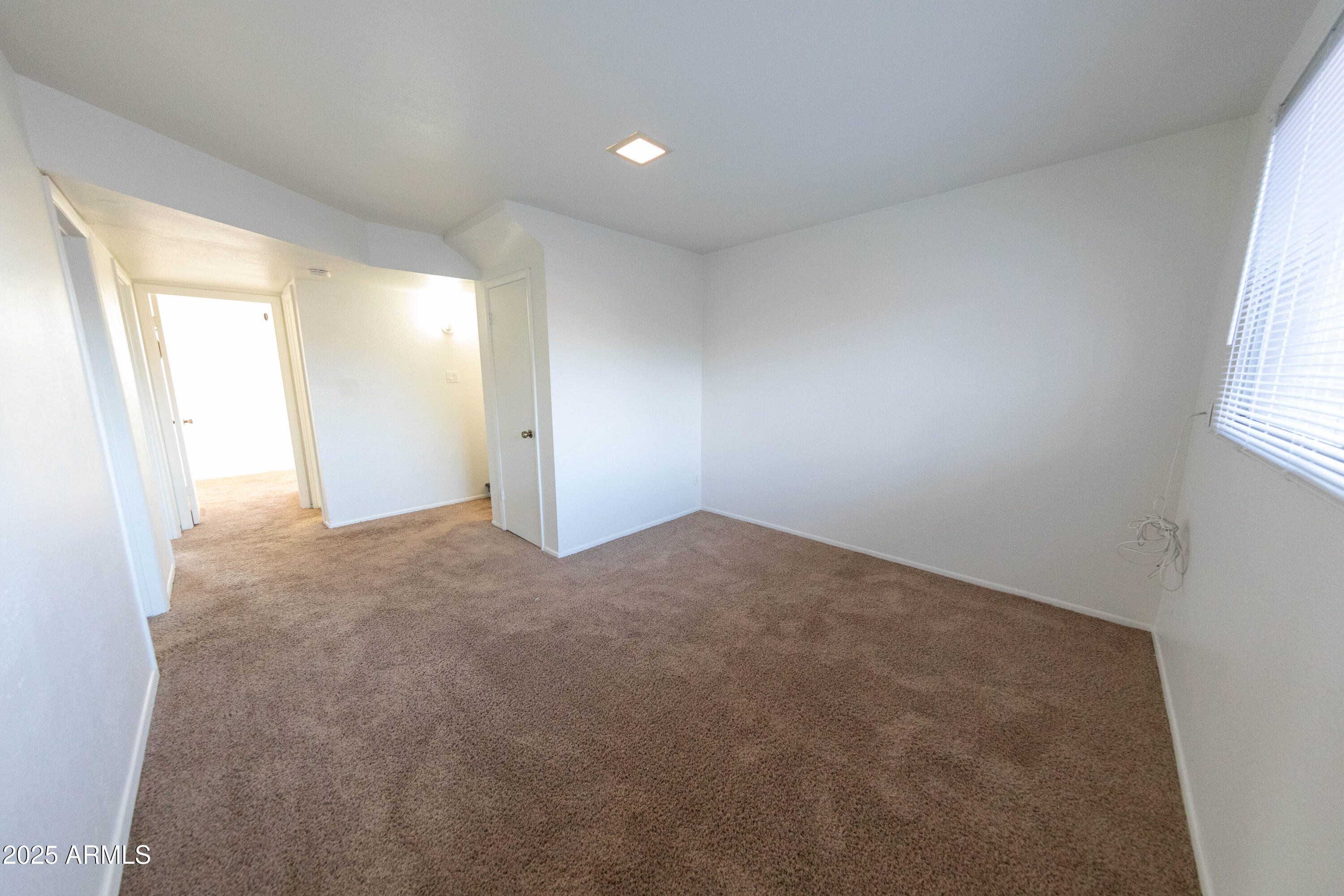 1349 East Donner Drive Tempe, AZ 85282 - Photo 10 of 26 an empty room with windows