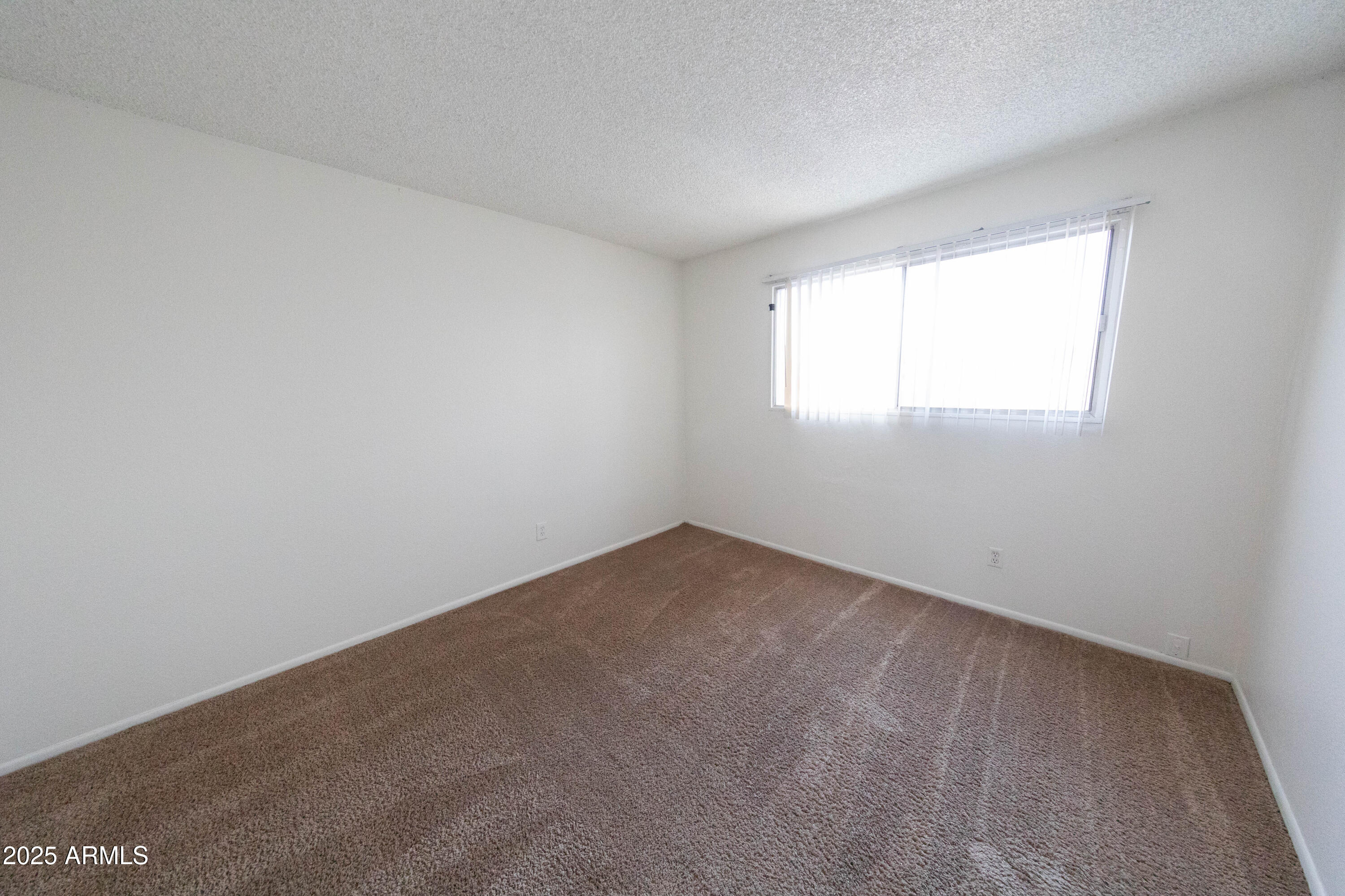 1349 East Donner Drive Tempe, AZ 85282 - Photo 12 of 26 an empty room with a window