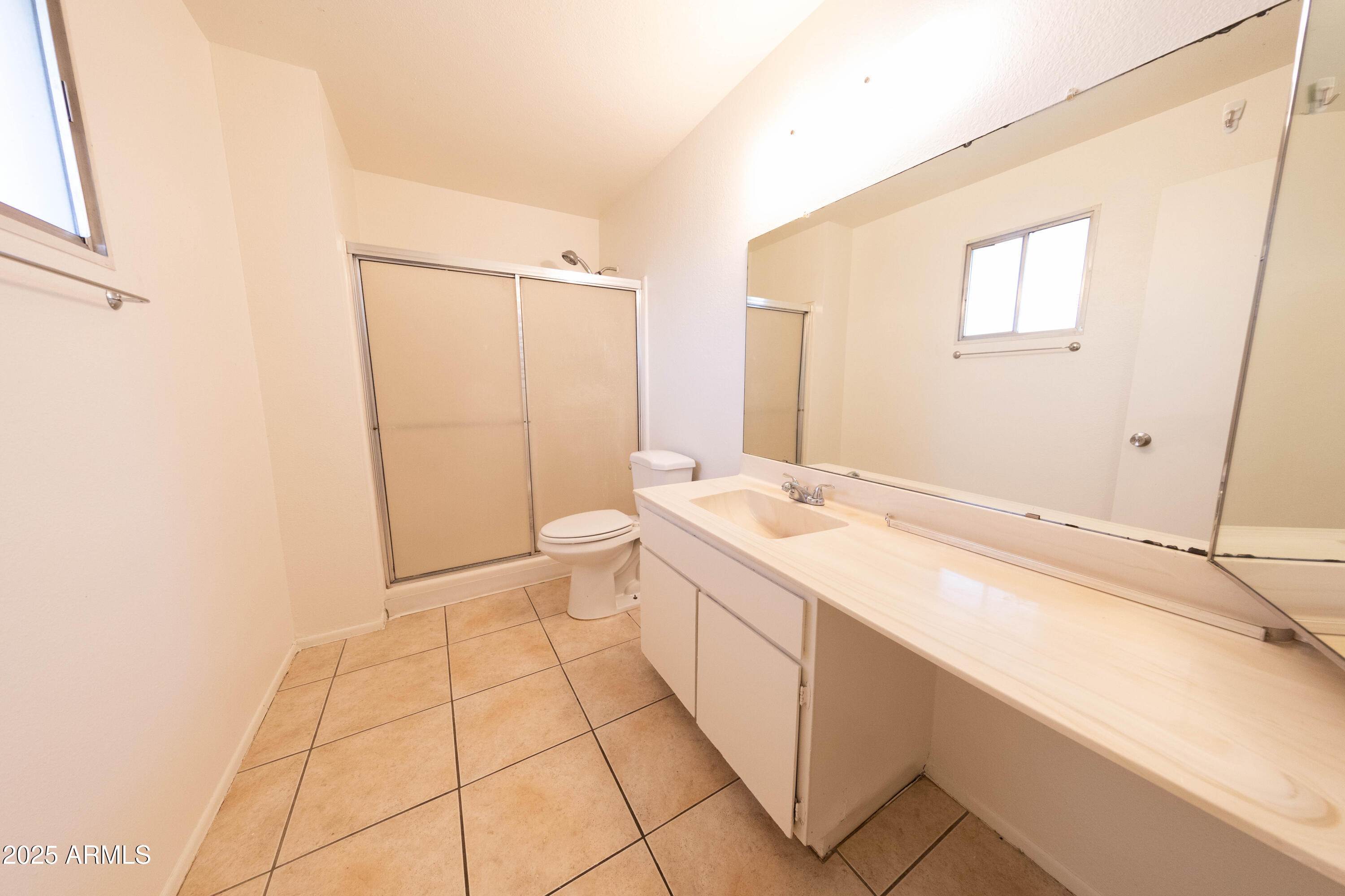 1349 East Donner Drive Tempe, AZ 85282 - Photo 18 of 26 a spacious bathroom with a granite countertop sink a mirror and a bathtub