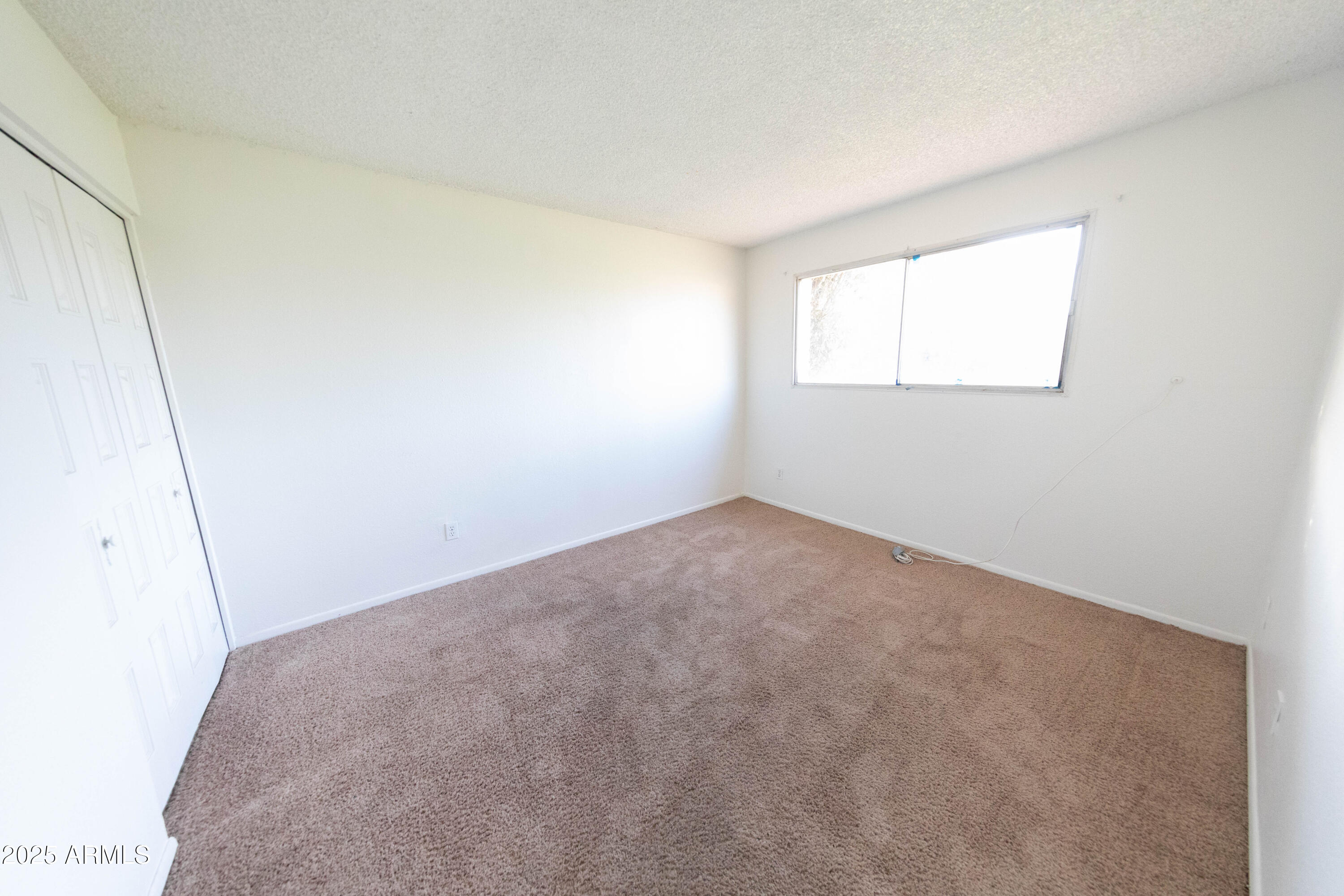 1349 East Donner Drive Tempe, AZ 85282 - Photo 19 of 26 a view of a room that has a window in it