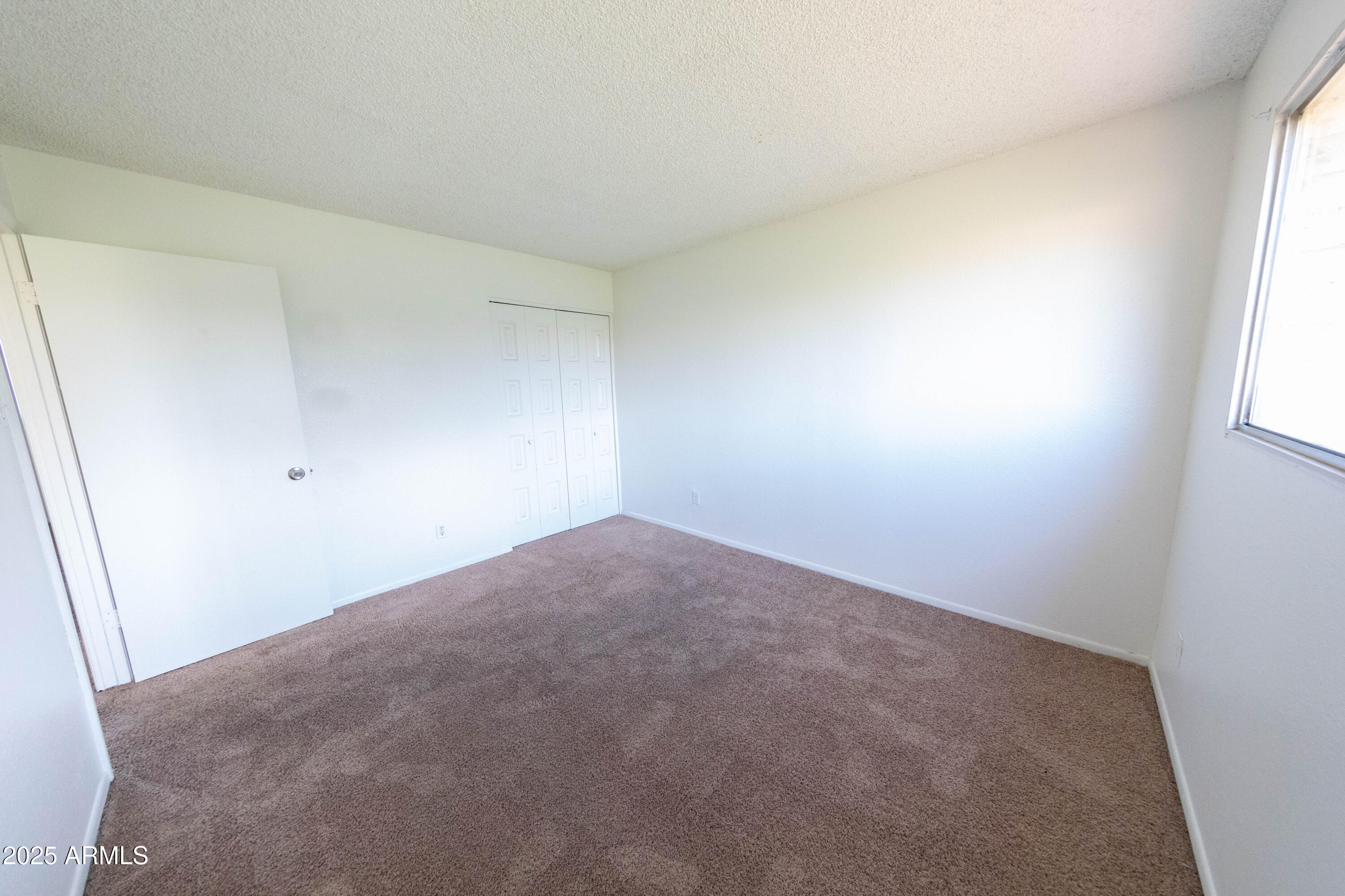 1349 East Donner Drive Tempe, AZ 85282 - Photo 20 of 26 an empty room with windows