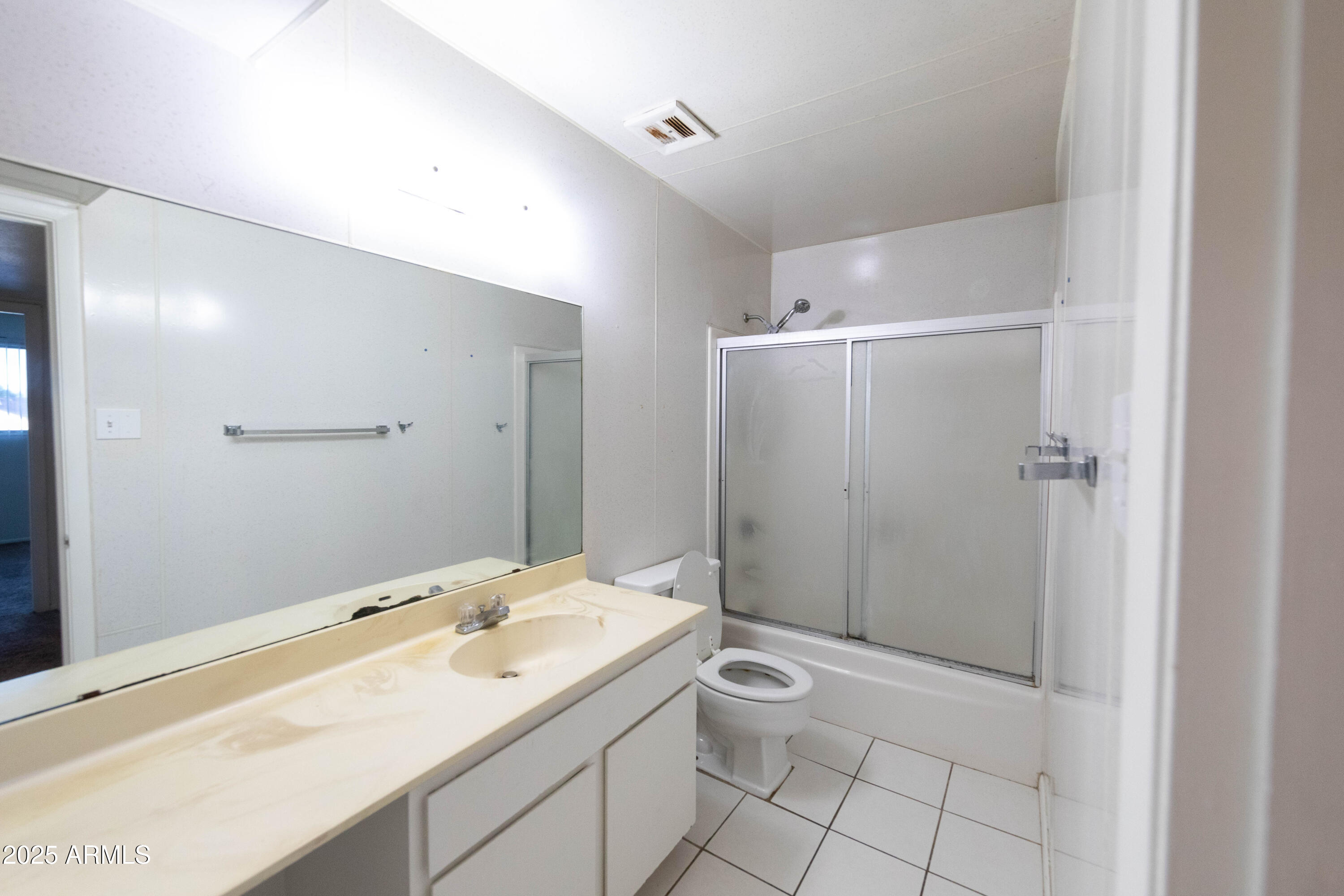 1349 East Donner Drive Tempe, AZ 85282 - Photo 22 of 26 a bathroom with a sink toilet and shower