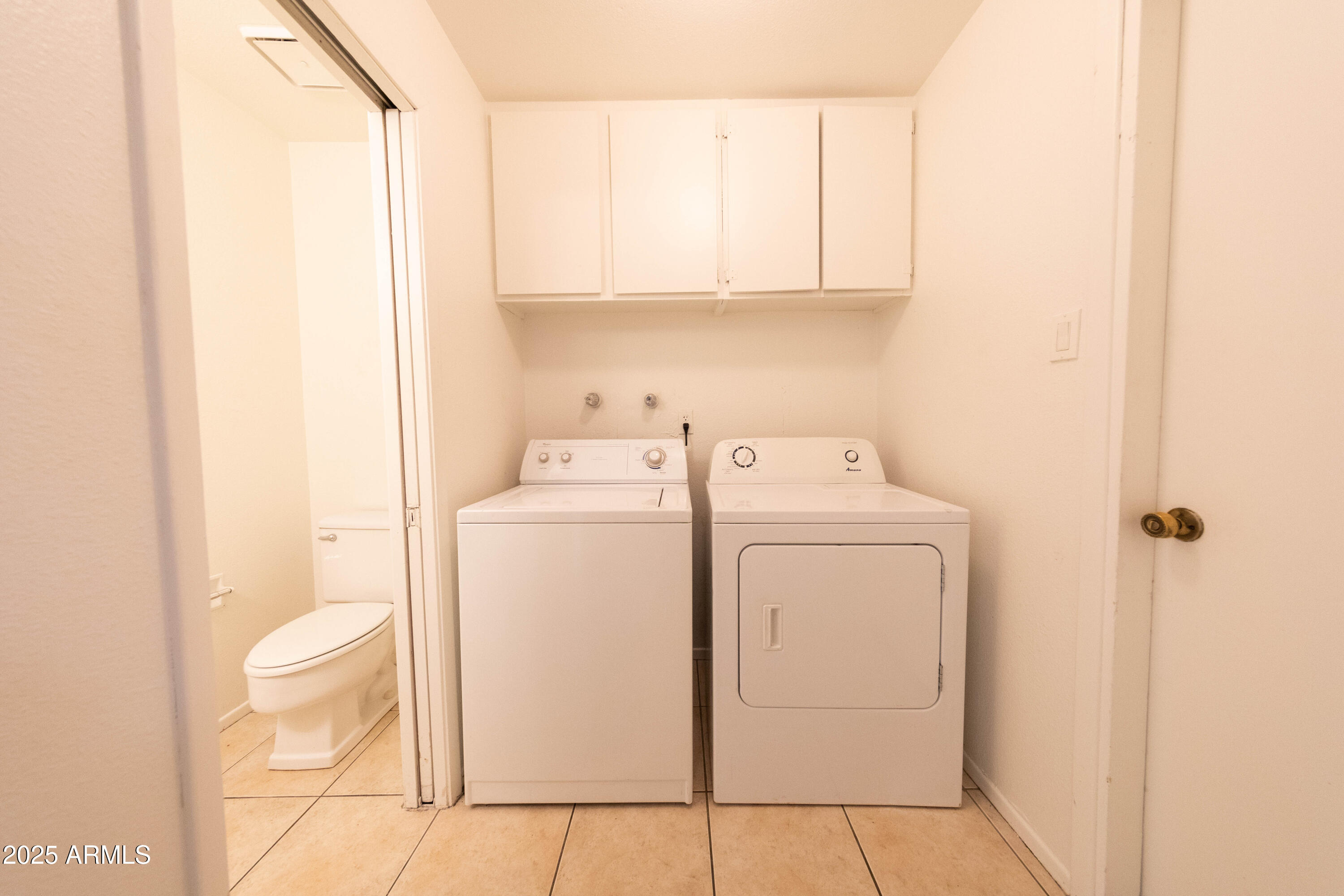 1349 East Donner Drive Tempe, AZ 85282 - Photo 23 of 26 a utility room with dryer and washer