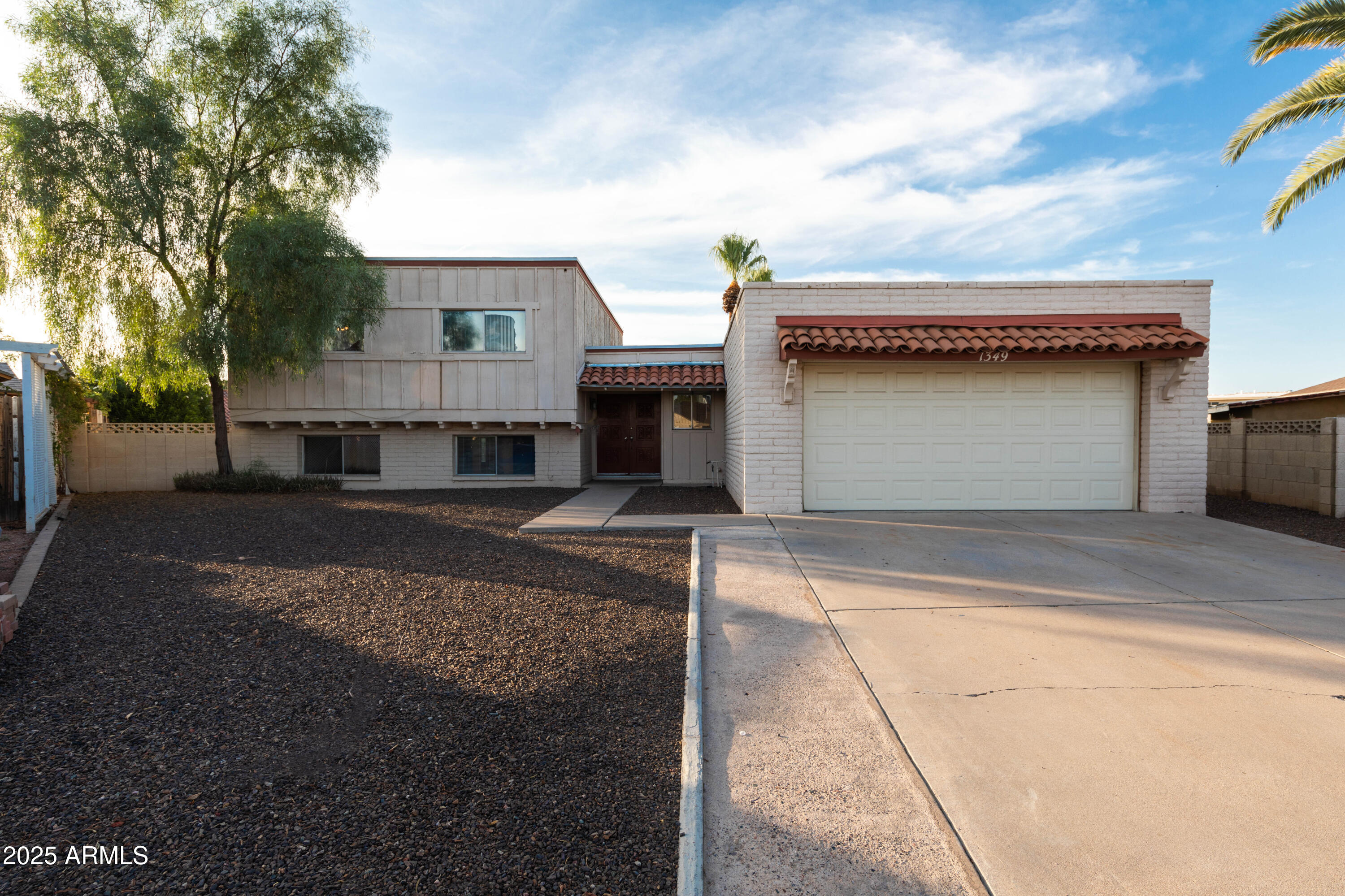 1349 East Donner Drive Tempe, AZ 85282 - Photo 2 of 26 a front view of a house with a yard