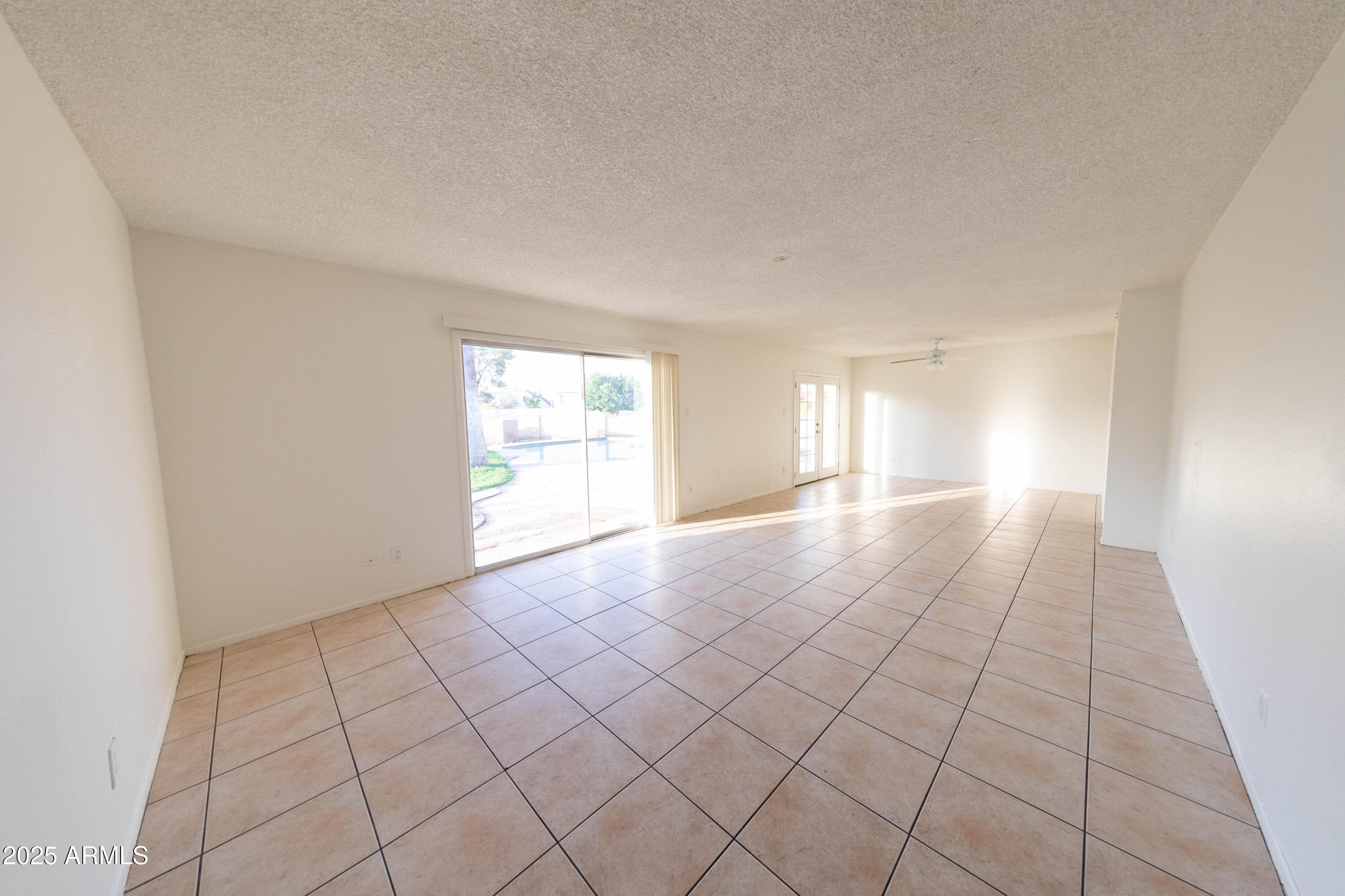 1349 East Donner Drive Tempe, AZ 85282 - Photo 5 of 26 a view of an empty room and window