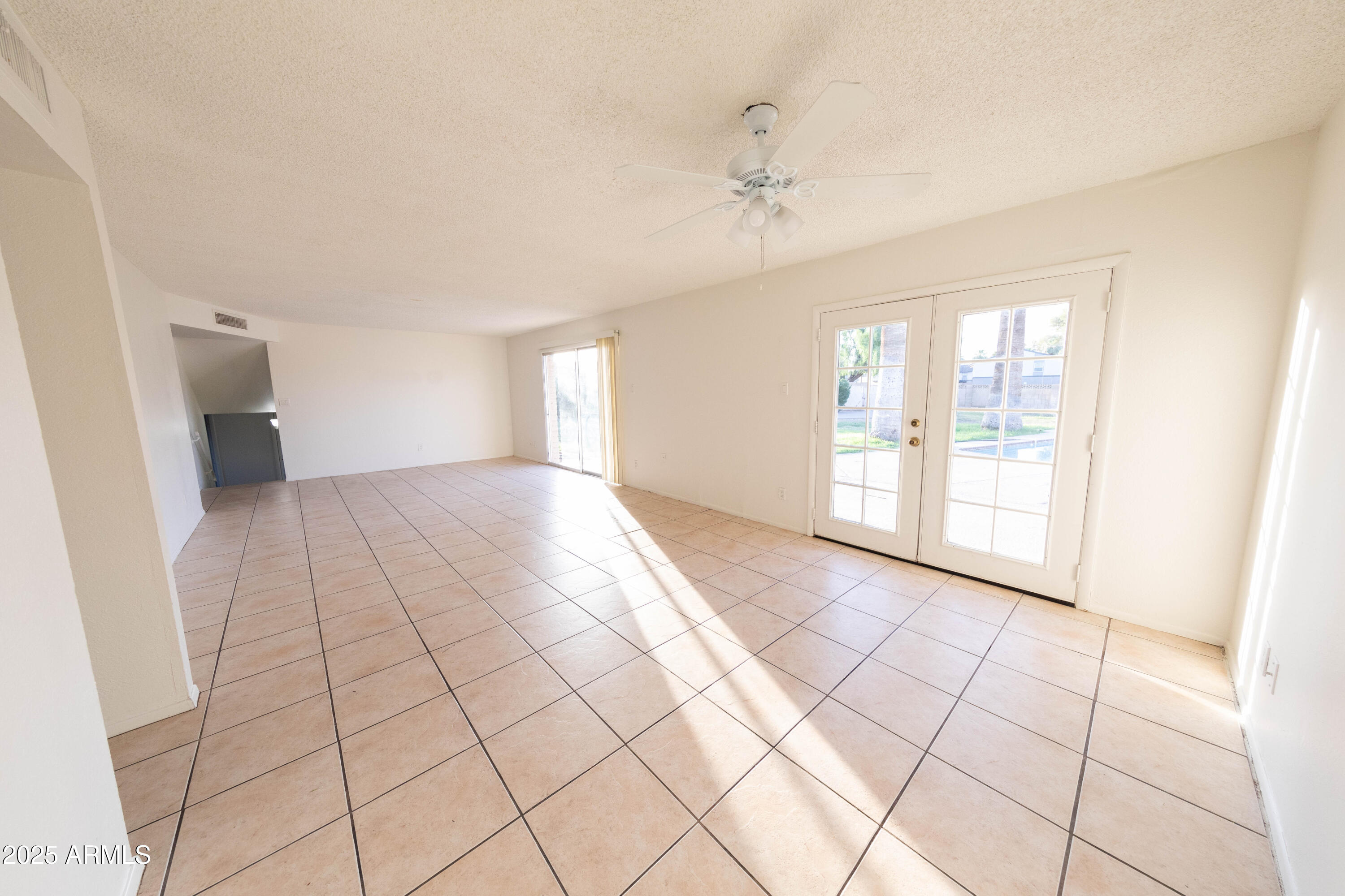 1349 East Donner Drive Tempe, AZ 85282 - Photo 6 of 26 a view of an empty room and window