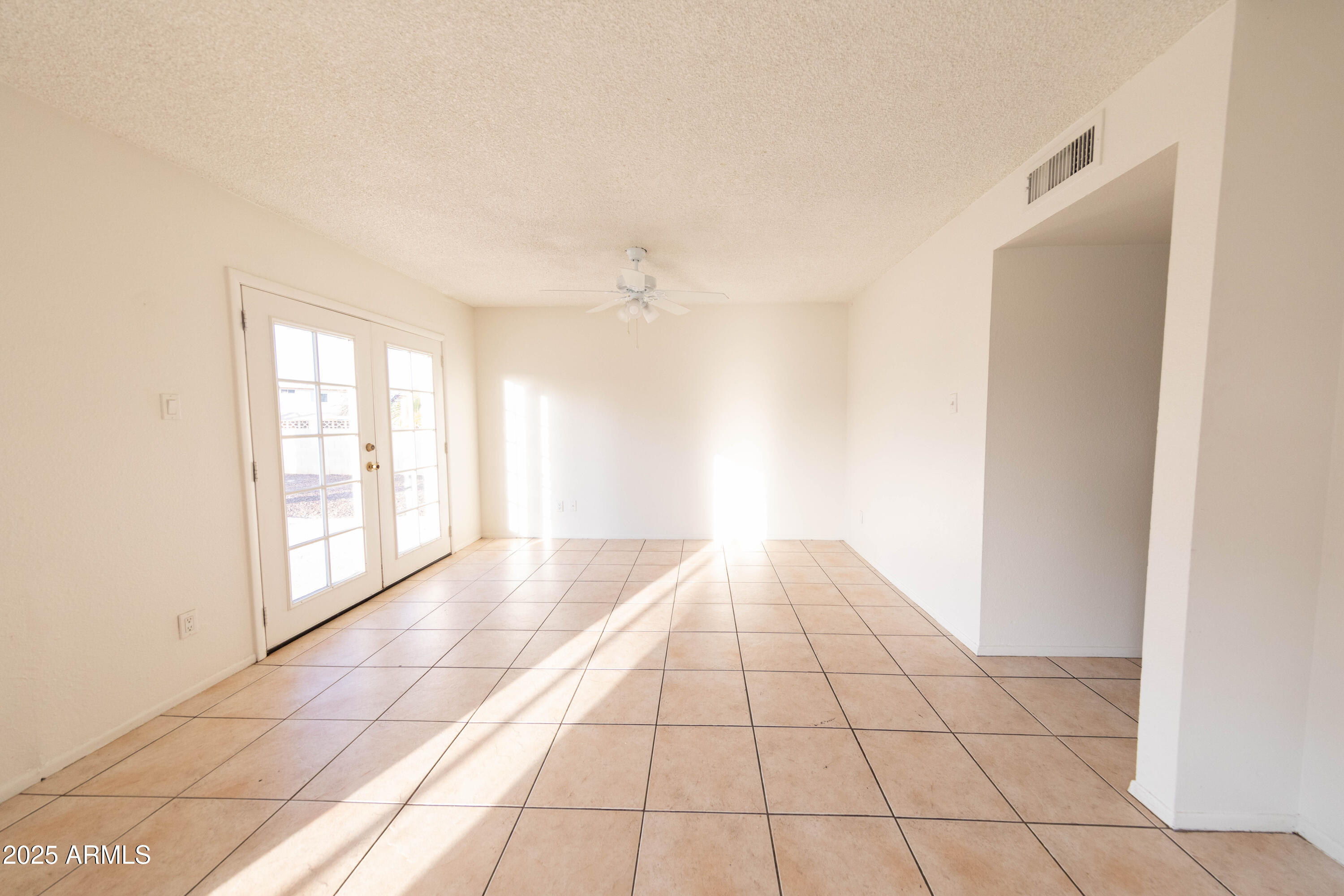 1349 East Donner Drive Tempe, AZ 85282 - Photo 8 of 26 a view of an empty room and window
