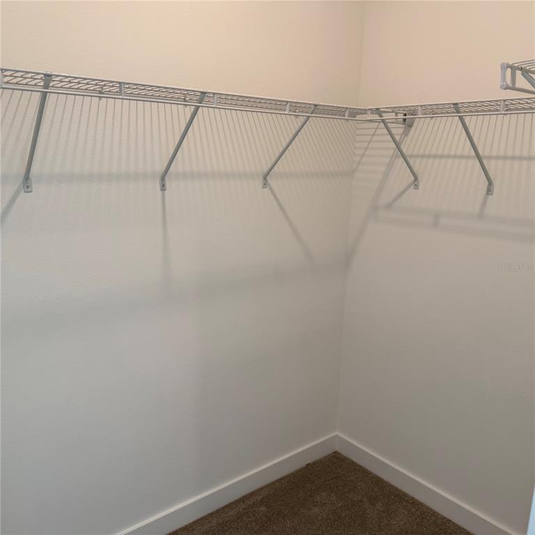 3245 Sustainable Way Kissimmee, FL 34747 - Photo 11 of 35 a small space with a fan and a window