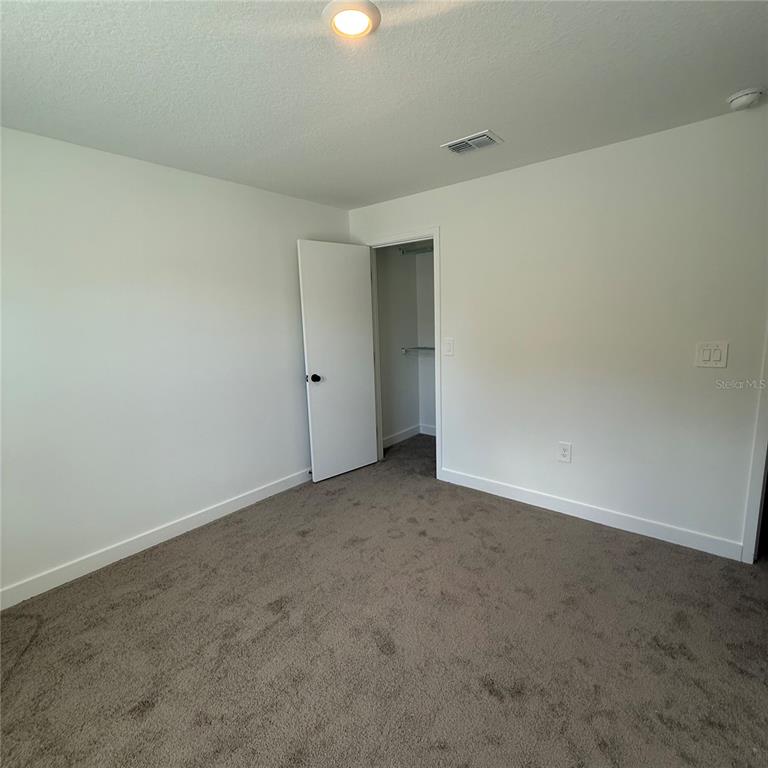 3245 Sustainable Way Kissimmee, FL 34747 - Photo 14 of 35 a view of an empty room