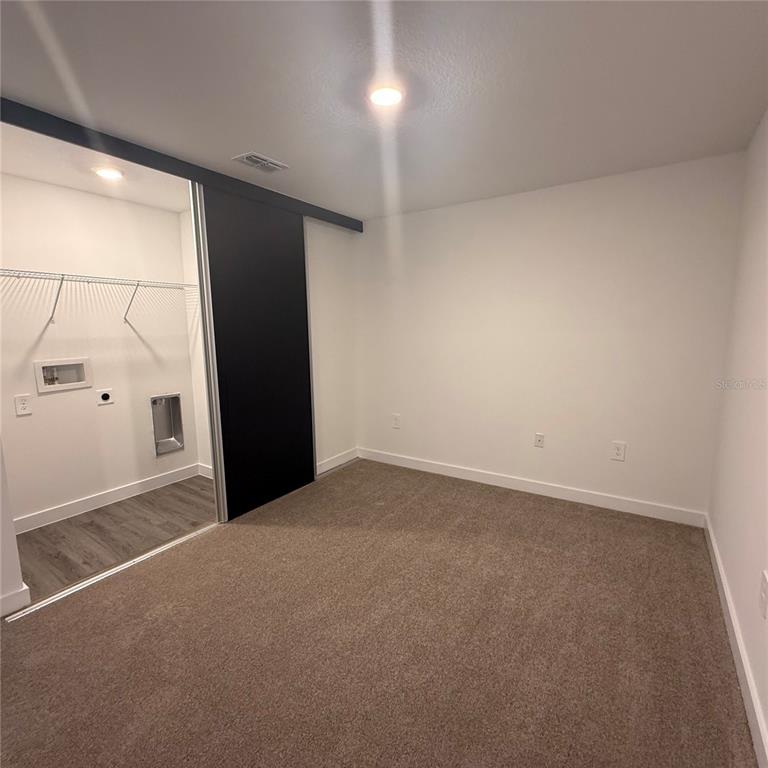 3245 Sustainable Way Kissimmee, FL 34747 - Photo 18 of 35 a view of an empty room with a window
