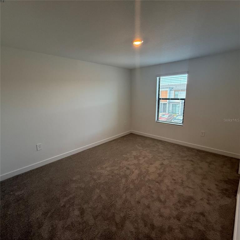 3245 Sustainable Way Kissimmee, FL 34747 - Photo 19 of 35 an empty room with a window