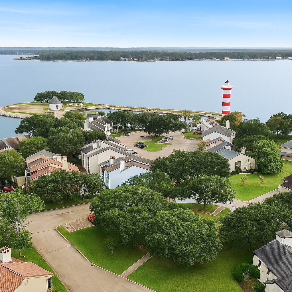 1901 Clipper Court Willis, TX 77318 - Photo 18 of 23 an aerial view of a house with a yard and lake view