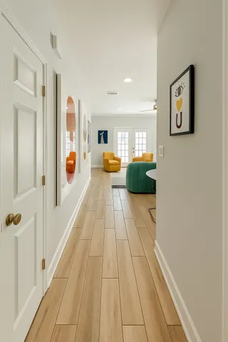 a view of a hallway with seating area