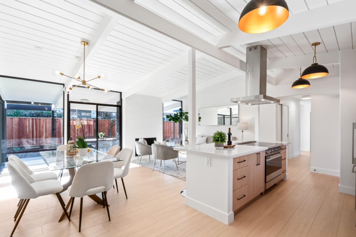 1714 Celeste Drive San Mateo, CA 94402 - Photo 15 of 45 a living room with stainless steel appliances kitchen island granite countertop furniture and a fireplace