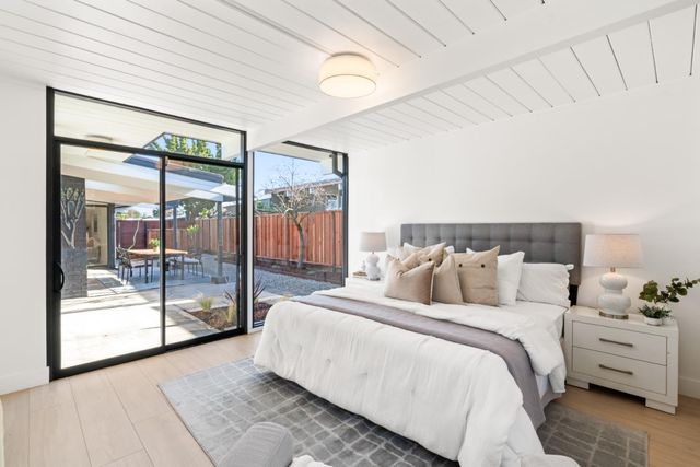 a bedroom with a bed and a couch