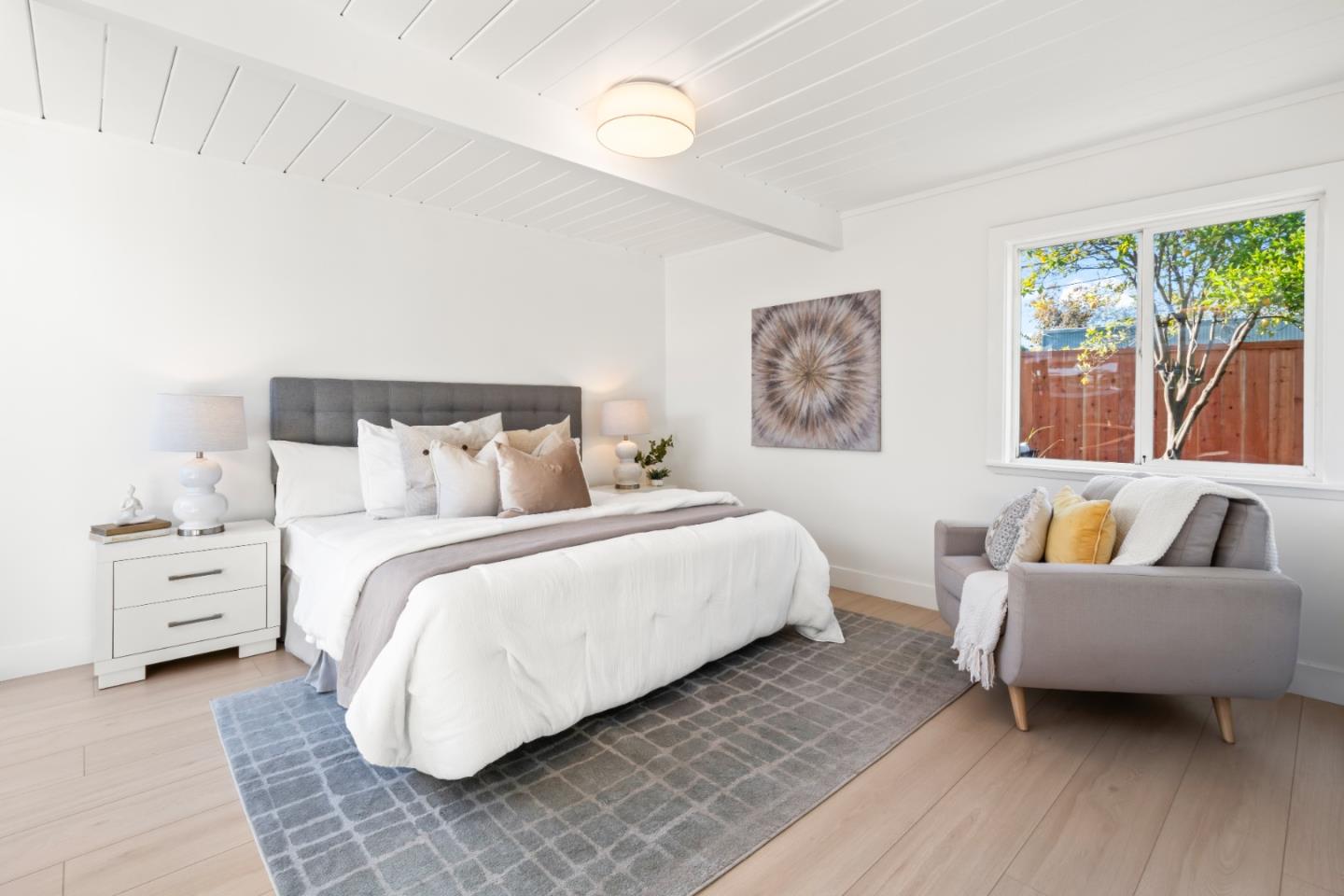 1714 Celeste Drive San Mateo, CA 94402 - Photo 22 of 45 a bedroom with a bed and a couch