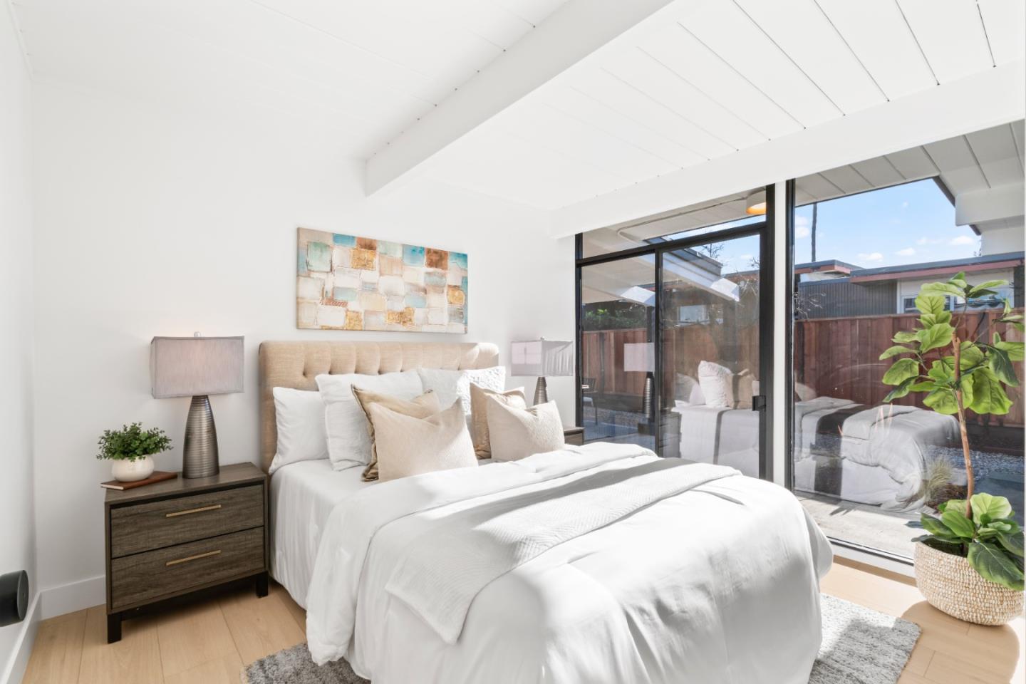 1714 Celeste Drive San Mateo, CA 94402 - Photo 26 of 45 a bedroom with a bed and a potted plant