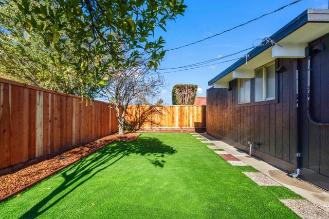 a view of yard with patio