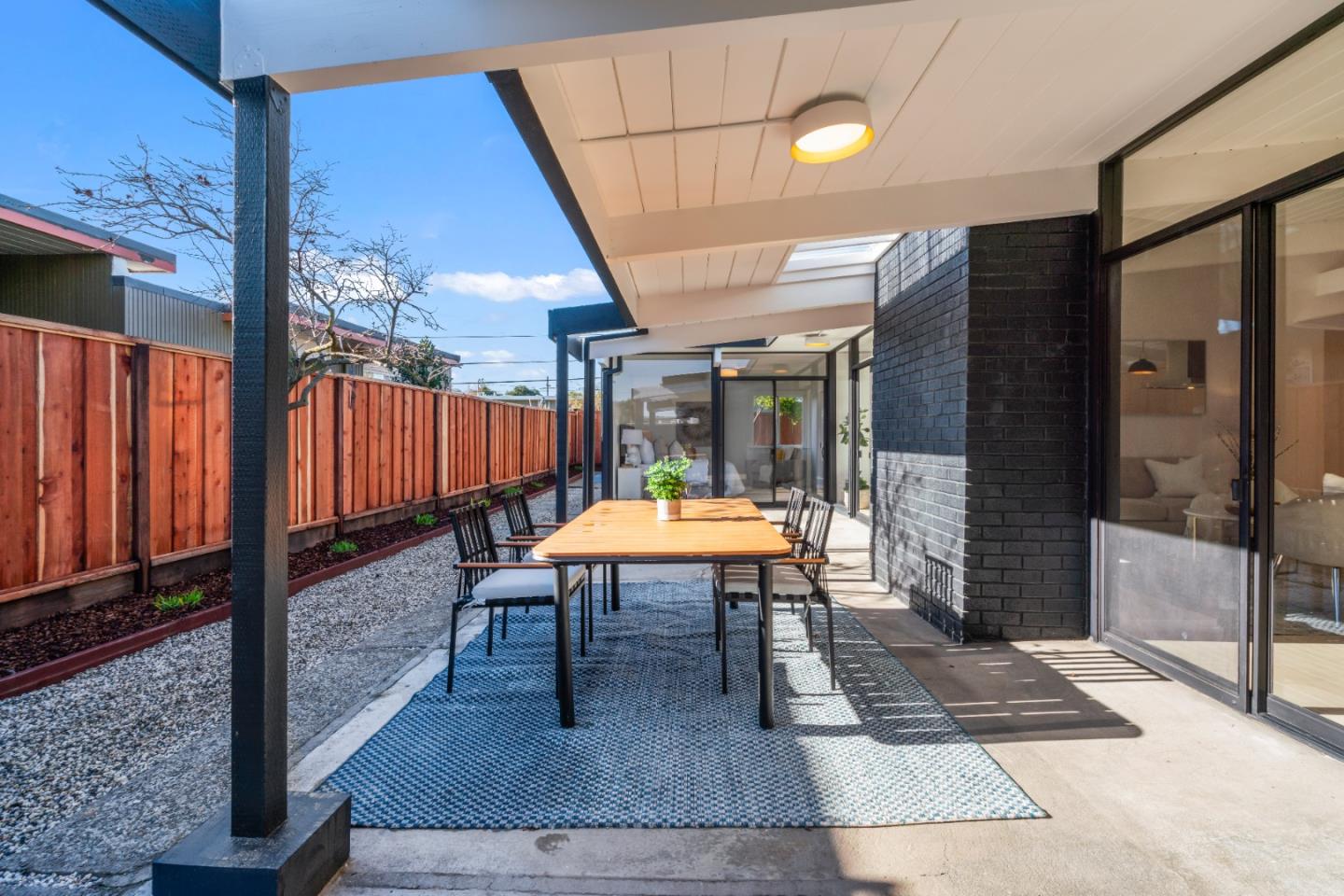 1714 Celeste Drive San Mateo, CA 94402 - Photo 39 of 45 a view of a porch with a table and chairs
