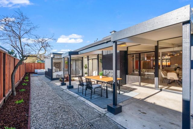 an empty room with air conditioner and windows