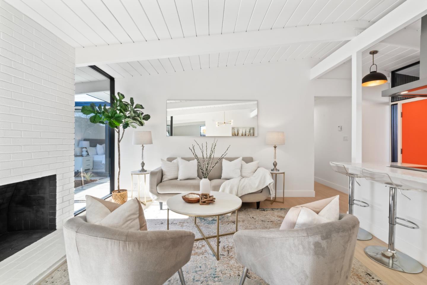 1714 Celeste Drive San Mateo, CA 94402 - Photo 6 of 45 a living room with furniture a chandelier and a fireplace