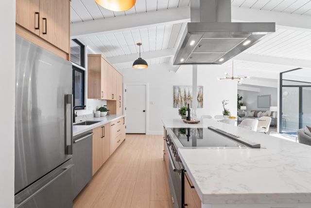 a kitchen with sink and window